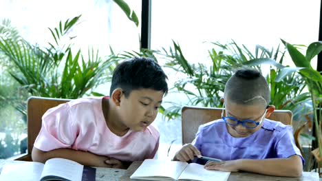 Asian-boy-two-people-Read-books.-education-concept