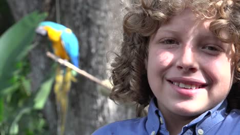 Boy-Smiling-with-Parrot