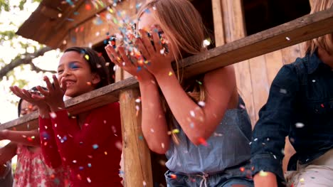 colorful-confetti-being-blown-at-camera-by-children-in-Slow-Motion