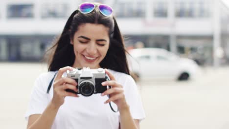 Woman-taking-picture-and-laughing