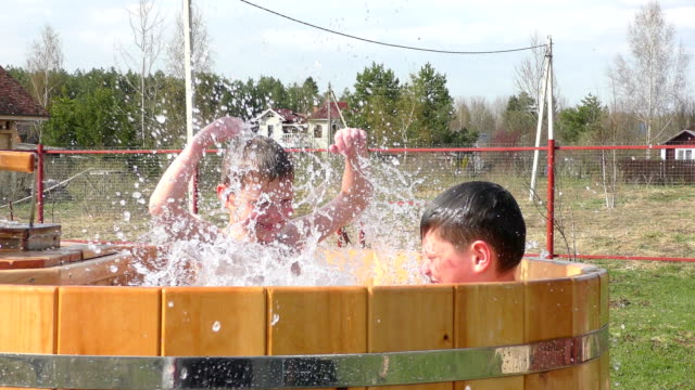 Two-brothers-having-fun-with-splashes