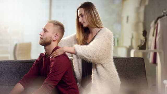 Young-woman-gives-his-boyfriend-a-beautiful-neck-massage