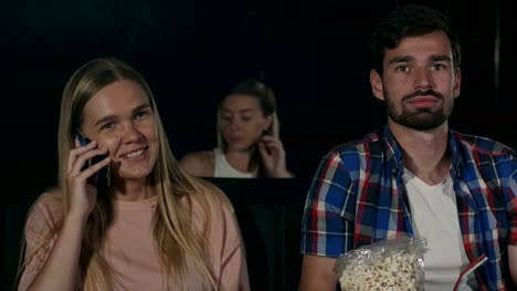 Annoying-woman-on-the-phone-during-movie-at-the-cinema