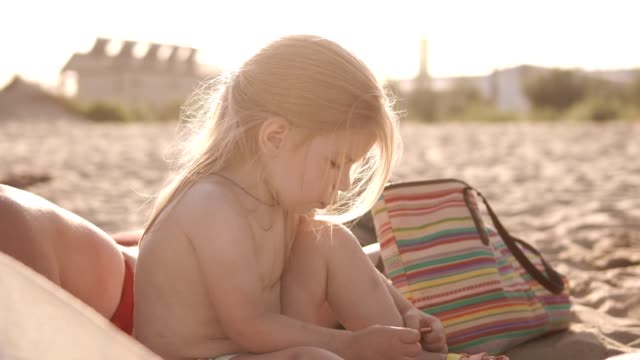 Little-girl-at-sea-on-the-beach-in-sunny-weather