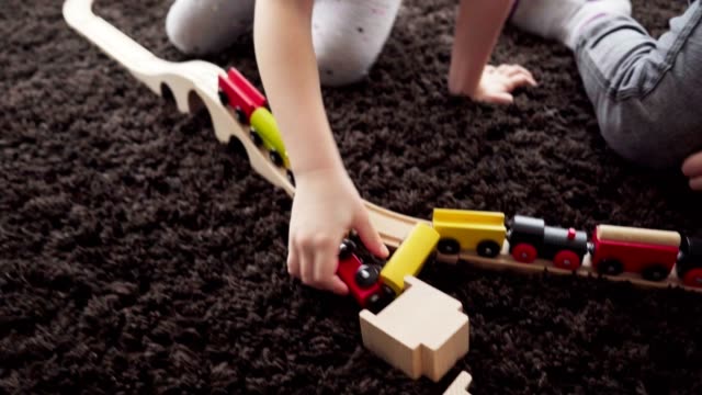 Children-build-wood-model-toy-locomotive