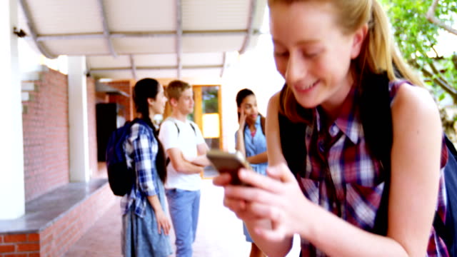 Schoolgirl-using-mobile-phone-4k