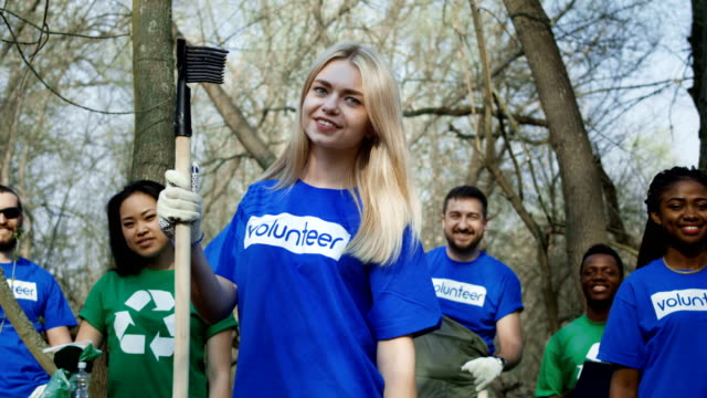 Smiling-girl-with-group-of-volunteers