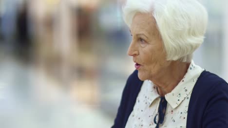 Elderly-Woman-Talking-to-Friends