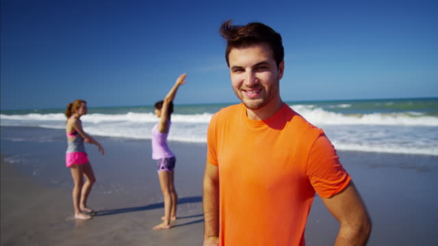 Portrait-of-Caucasian-American-male-exercising-on-beach