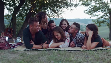 group-of-friends-making-faces-during-the-pic-nic.-shot-in-slow-motion
