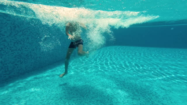 Underwater-Young-Boy-Fun-in-the-Swimming-Pool