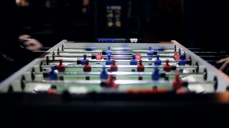 Friends-having-fun-together-playing-table-football