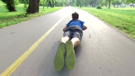 Cool-guy-longboarding-lying-down