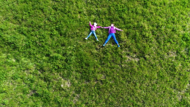 Aerial-shot-of-children-at-green-grass