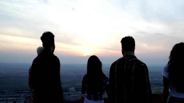 People-On-Mountain-Top-Back-Rear-View-Enjoying-Landscape,-Friends-Group-Tourists-Looking-At-Sunrise