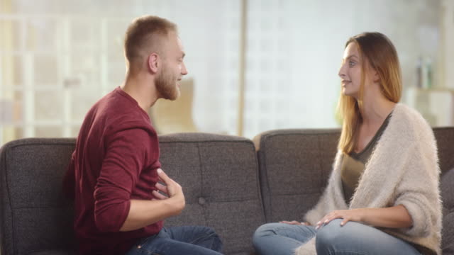 Young-couple-having-differences-on-a-couch