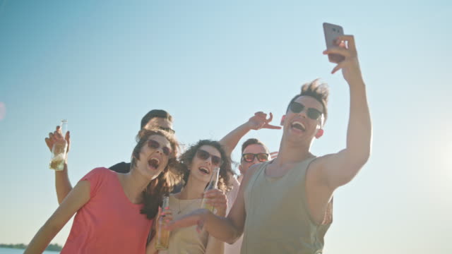 Young-People-Making-a-Selfie-on-the-Beach