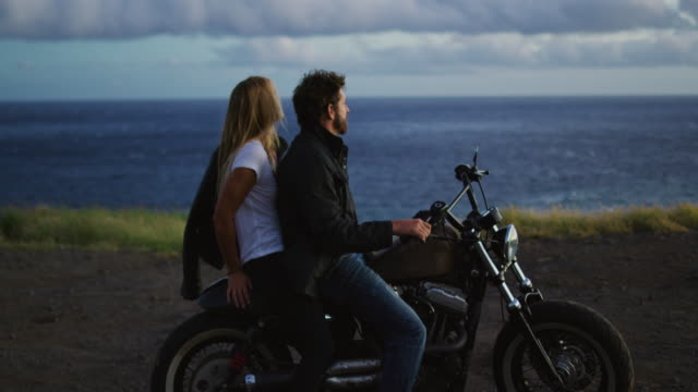 Couple-on-Motorcycle-Watching-the-Sunset