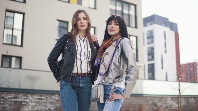portrait-of-two-young-fashionable-girls-in-the-spring-city
