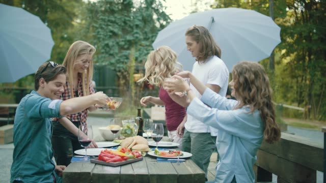 People-Eating-Healthy-Food-On-Outdoor-Party.