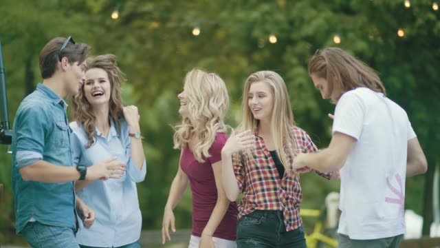 Happy-Friends-Dancing,-Having-Fun-And-Enjoying-Party-Outdoors.