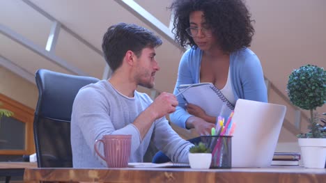 Mixed-race-business-partners-working-at-office