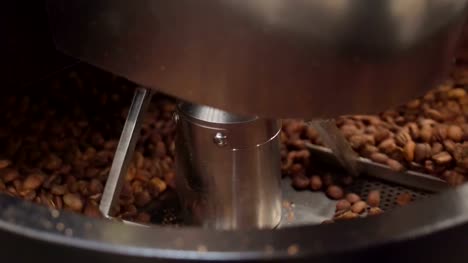 The-coffee-machine-mixing-the-coffee-beans-inside