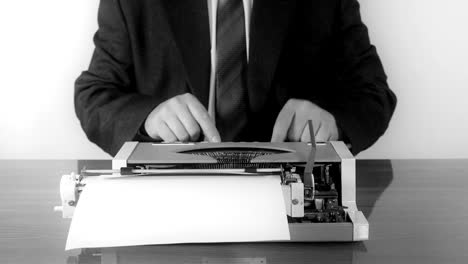 Man-typing-on-a-manual-typewriter