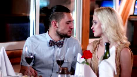 man-and-woman-on-a-date-in-a-restaurant,-romantychesky-dinner-in-the-restaurant,-the-husband-and-wife-spend-time-together,-loving-man-and-woman-drinking-wine