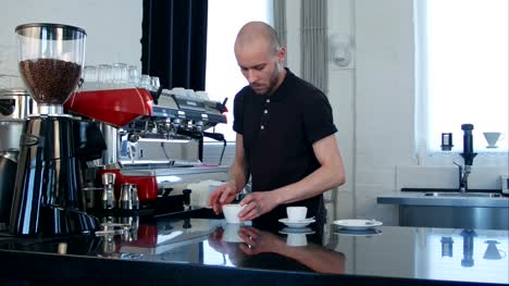 Barista-prepares-cappuccino-in-coffee-shop