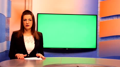 Young-woman-TV-presenter-,Green-Screen-background