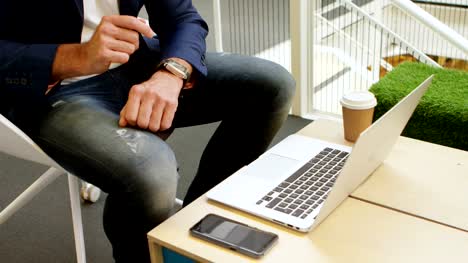 Businessman-using-smartwatch-in-office-4k