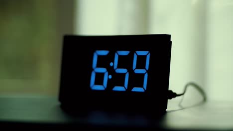 dolly-shot-of-alarm-clock-turns-7-AM