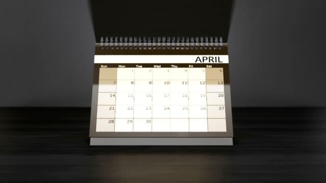 Flagged-days-in-monthly-calendar-on-desk-year-calendar.