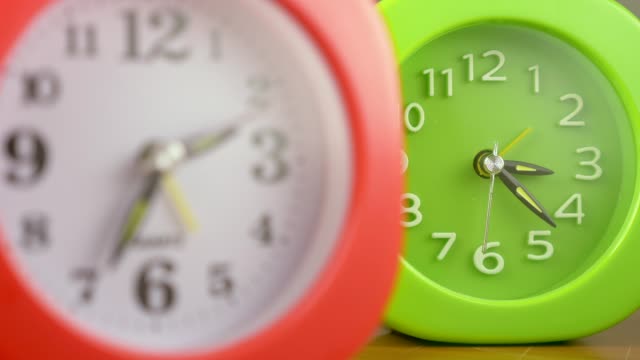 Two-clocks-beating-time.-Time-passing,pressure--change-of-focus
