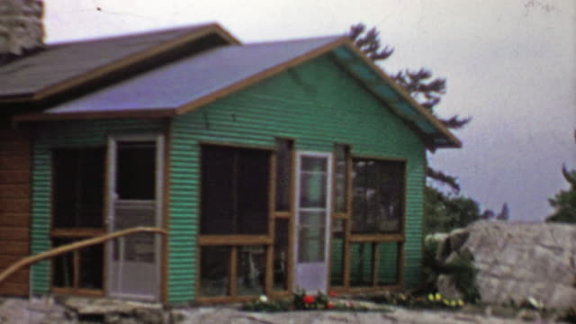 1957:-Vacation-rental-lake-home-screened-in-porch-addition.
