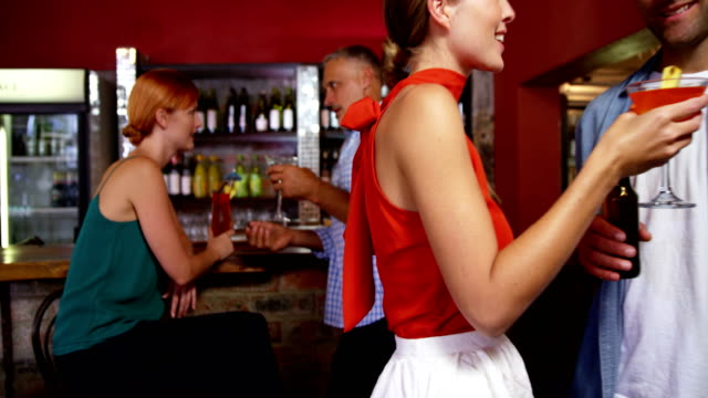 Friends-having-cocktail-in-restaurant
