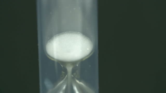 The-last-drops-of-sand-are-dropping-in-the-hourglass