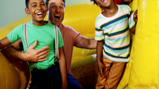Kids-playing-in-bouncy-castle-4k