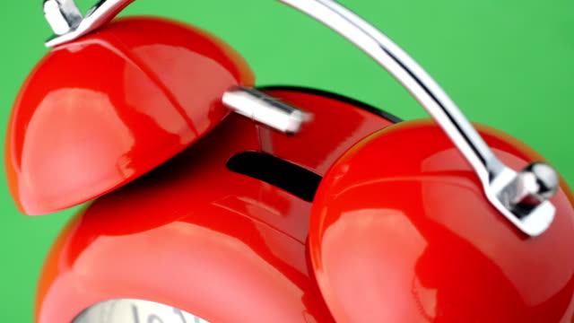Red-alarm-clock.-Green-screen.-Close-up-view.