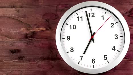 it's-seven-o'clock-already,-time-to-wake-up-for-breakfast,-modern-white-metallic-alarm-wall-clock-on-dark-wood