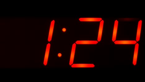 Time-showing-between-01:00-and-01:59-on-big-digital-clock