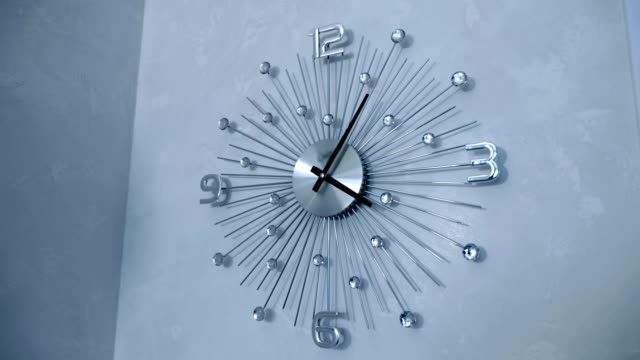 Beautiful-chrome-wall-clocks-with-decorative-glass-inserts-on-the-wall