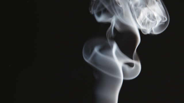 Curly-smoke-stream-on-black-background