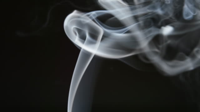 SLOW-MOTION:-Smoke-lifts-and-dispels-on-a-black-background