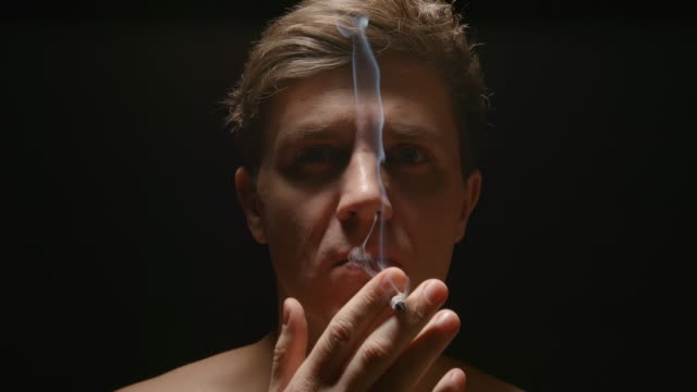 SLOW-MOTION:-Smoker-under-a-light