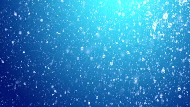 slow-motion-of-water-droplets-against-blue-gradient