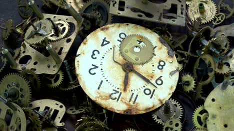 Vintage-analog-clock-brass-gears-and-cogs-with-rusty-dial-clock-face-rotating-background