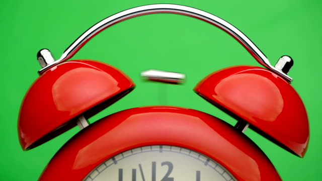 Red-alarm-clock.-Green-screen.-Close-up-view.