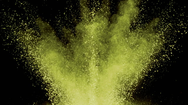 Yellow-powder-exploding-on-black-background-in-super-slow-motion